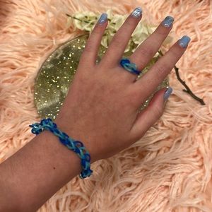 A handmade bracelet with a ring. For all ages and genders.